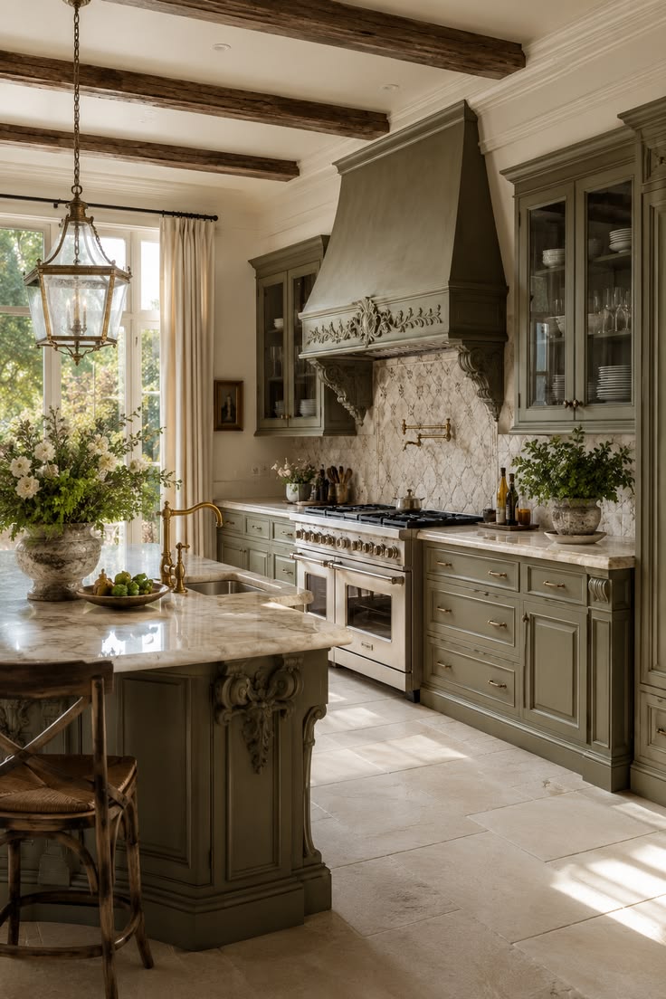 Olive green kitchen cabinetry with brass hardware and wood shelving